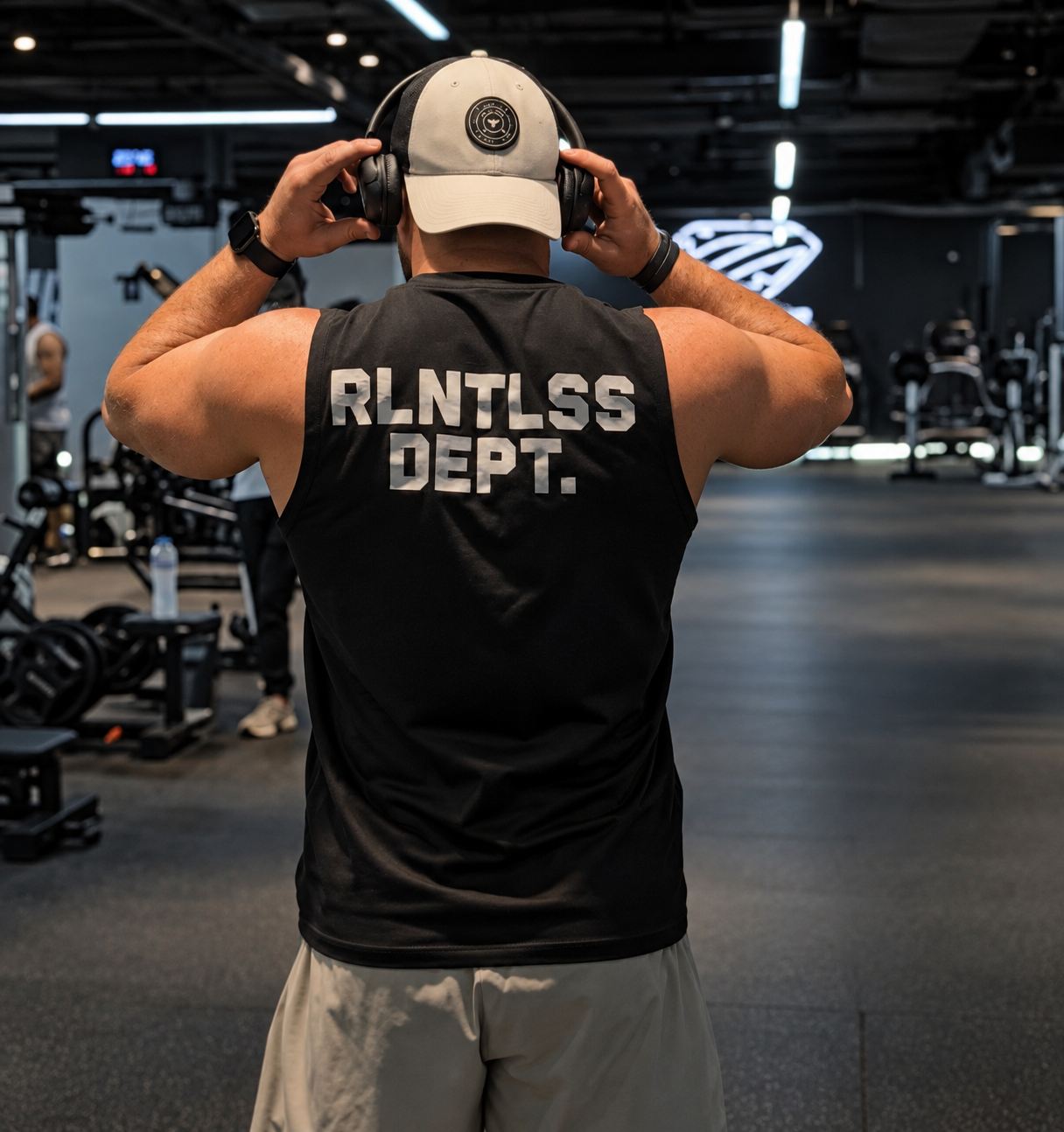 Mohamed Ismail wearing headphones at the gym